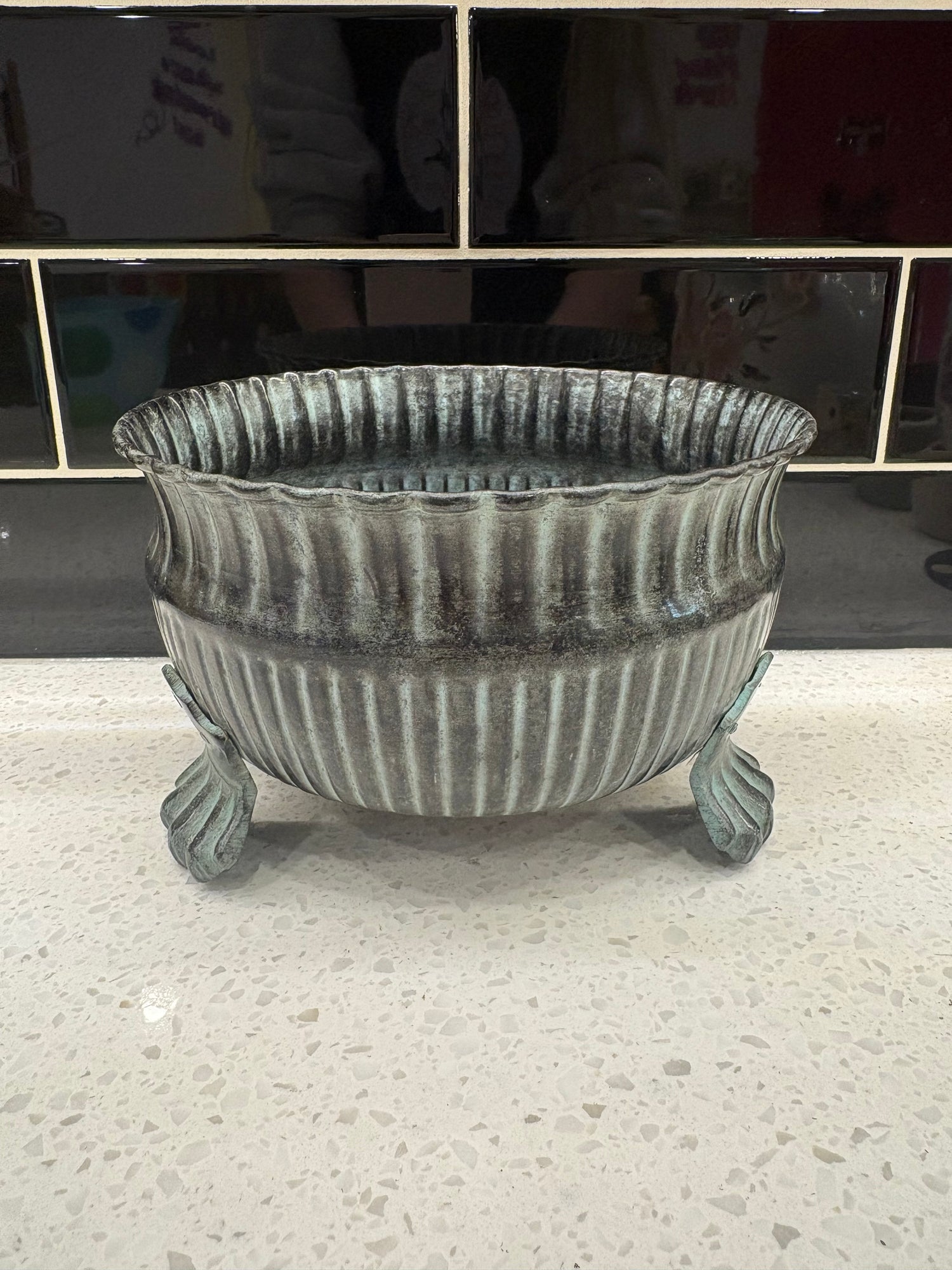 Medium grey metal with claw legs pot