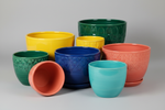 several 10" or larger colourful plant pots with no plants in them